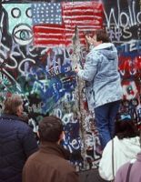 Berlin_citizens_chipping_at_wall.jpg